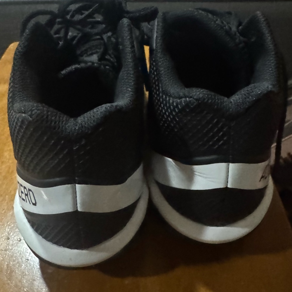 Adidas Black and White football cleats Modern Athletic Style